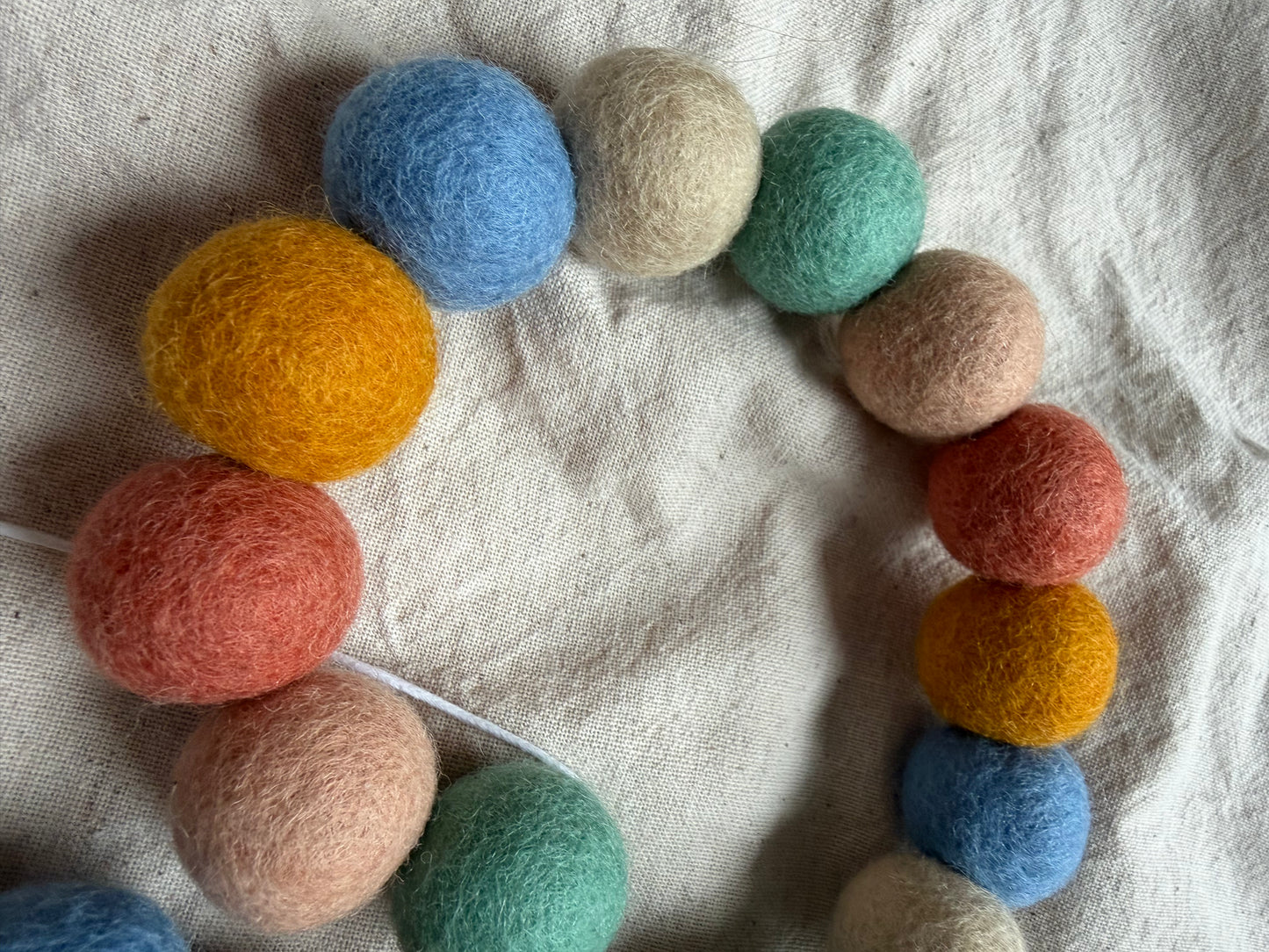 Muted rainbow felt ball garland