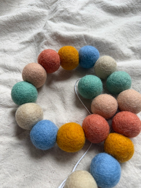 Muted rainbow felt ball garland