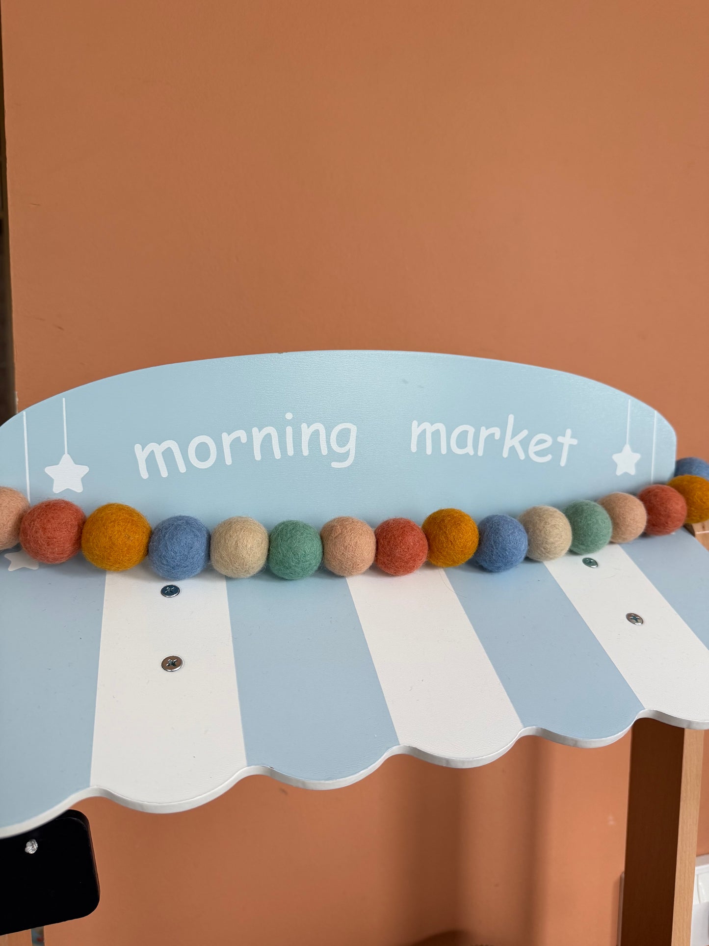 Muted rainbow felt ball garland